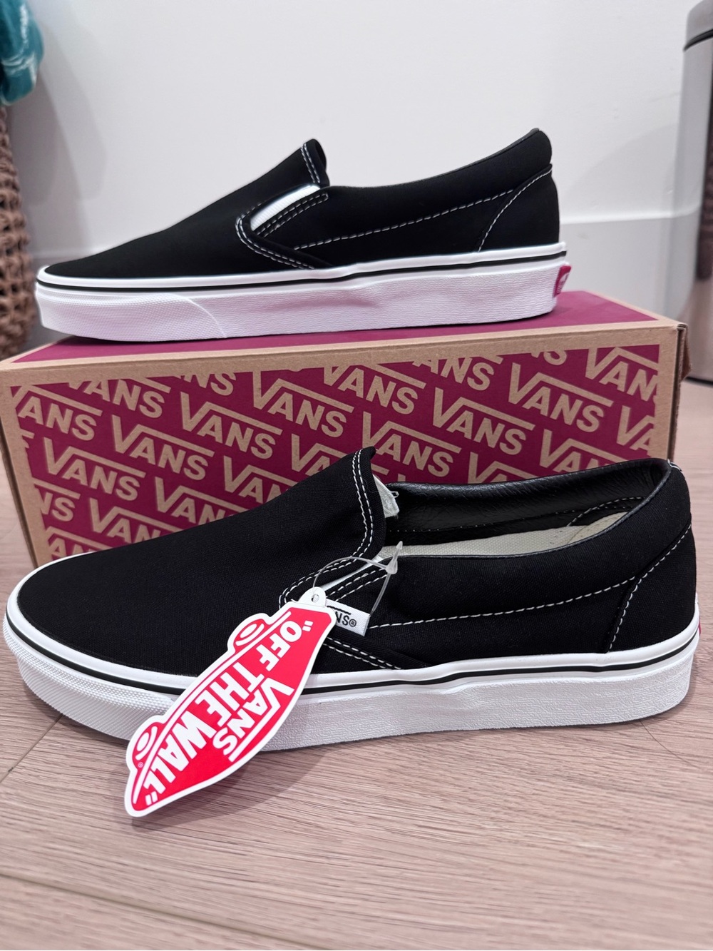 Vans Women's Slip-On Sneakers in Black and White